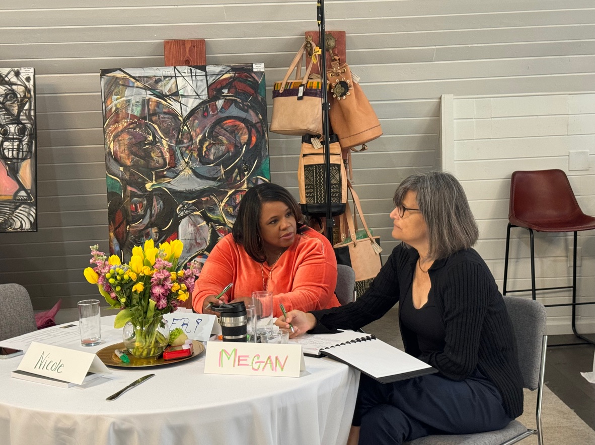 Two cohort participants talking at Wellspring Manor during the Spring 2024 Cohort of EASI.